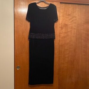 Beautiful black velvet dress w/ sequin accents on waist and sleeve.  Like new!
